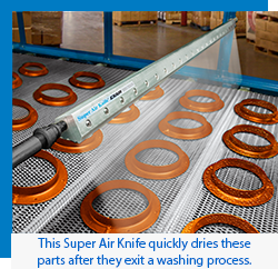 EXAIR Super Air Knife quickly dries these parts after they exit a washing process.