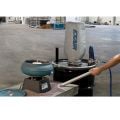 Heavy Duty Dry Vac vacuums up abrasive garnet from the work surface surrounding a vibratory bowl used to deburr parts.