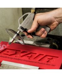 A VariBlast Compact Safety Air Gun blowing off plastic shavings from a CNC operation